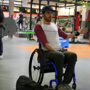 Ben Clark using d-ring aid in gym. Adaptive gym equipment. Suitable for reduced hand function: tetra, quad, cerebral palsy, SCI, spinal cord injury, stroke and more.
