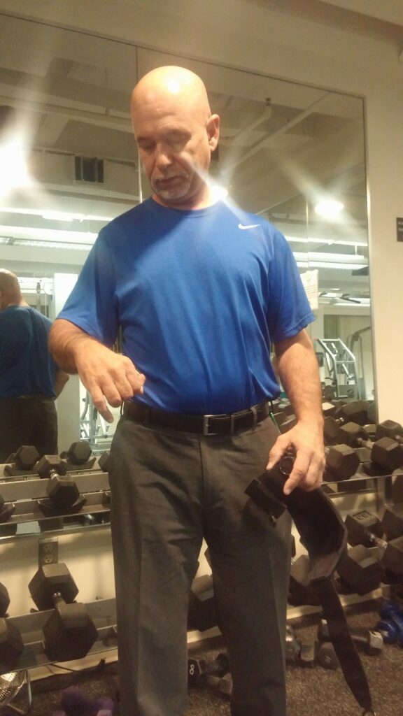 Jose in the gym with the General Purpose aid. Adaptive gym equipment. Suitable for reduced hand function: tetra, quad, cerebral palsy, SCI, spinal cord injury, limb difference, stroke and more.