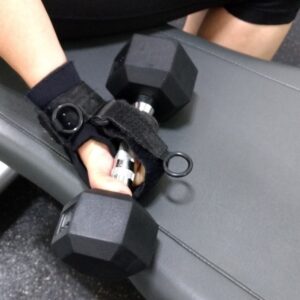 Limb Difference aid holding free weight.
