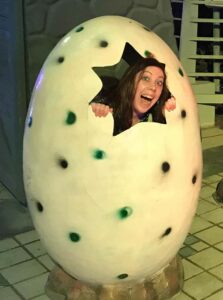 Mel, our director, in a dinosaur egg!