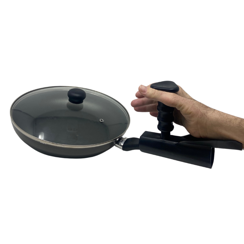 Pan buddy on pan being held by Rob who has limited hand function